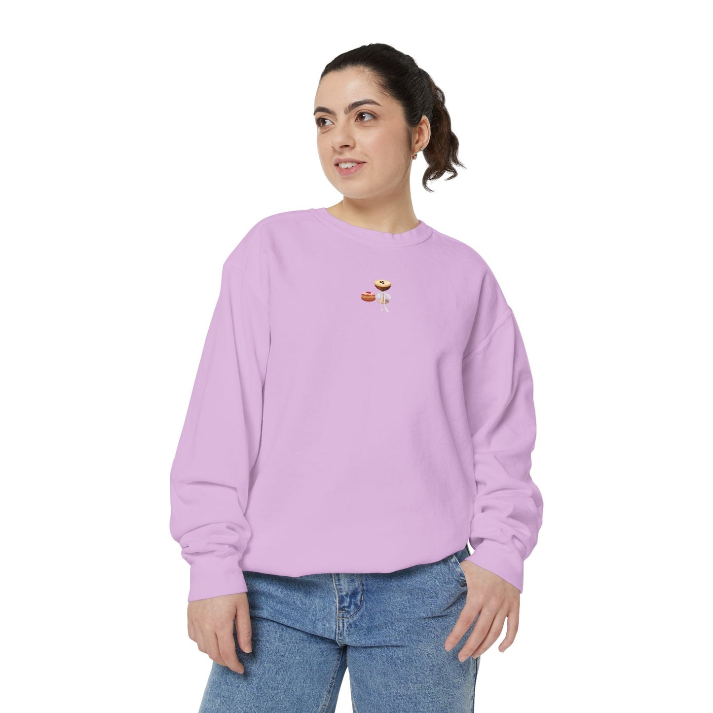 Woman wearing a small Hanukkah design embroidered on a light purple sweatshirt