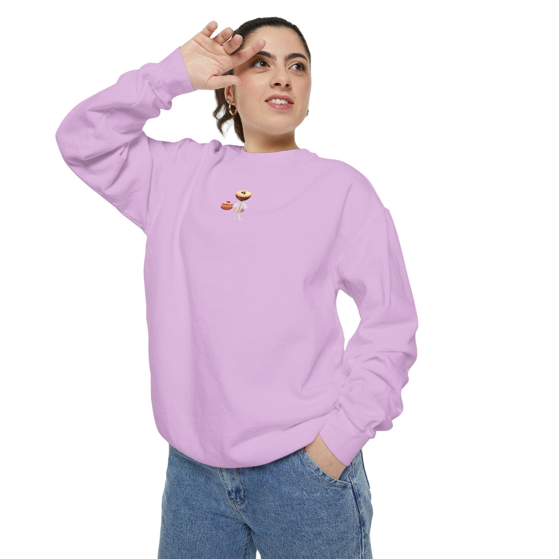 Woman posing wearing a small Hanukkah design embroidered on a light purple sweatshirt
