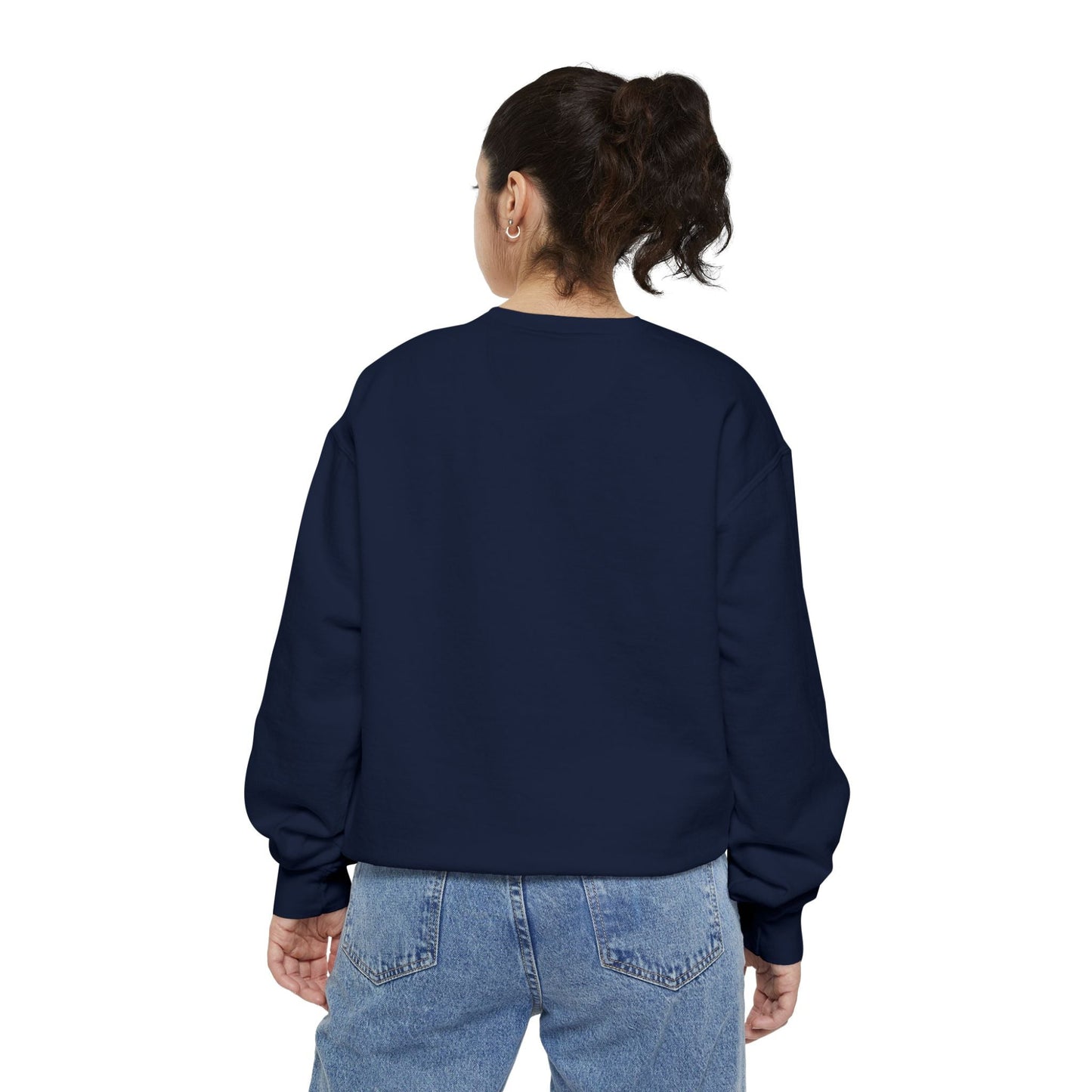Back view of a woman wearing a navy blue Hanukkah sweatshirt
