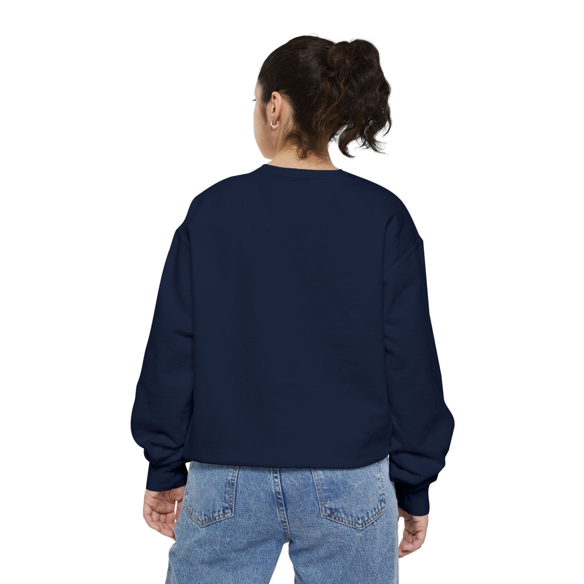 Back view of a woman wearing a navy blue Hanukkah sweatshirt