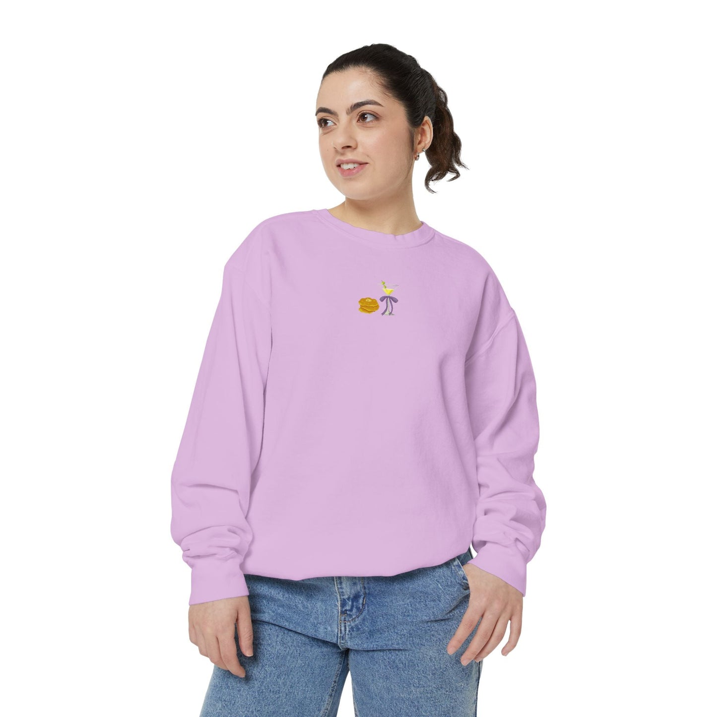 Woman wearing a light purple sweatshirt with a small embroidered Hanukkah design