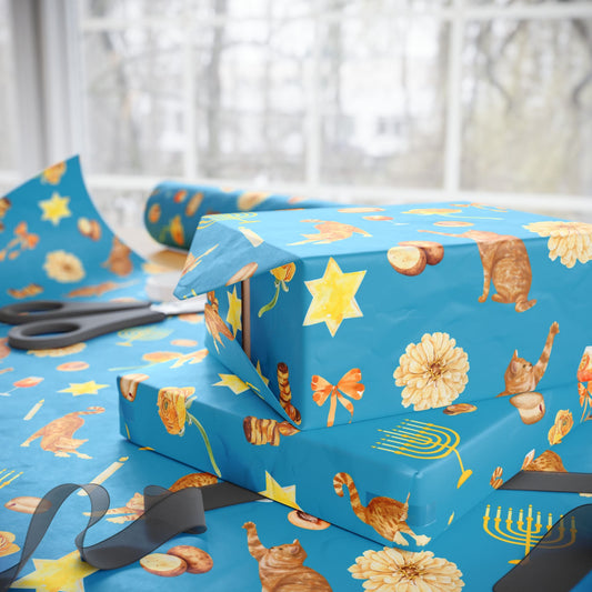 Wrapping Hanukkah presents in whimsical gift wrap with orange cats and golden menorahs
