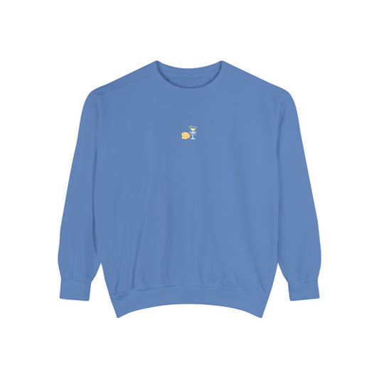 Blue sweatshirt with small embroidered stack of latkes and martini design at center chest