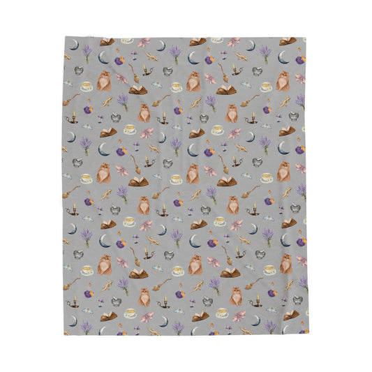 printed throw blanket featuring witchy aesthetic cats, brooms, cauldrons, herbs, potions, moths, and mushrooms