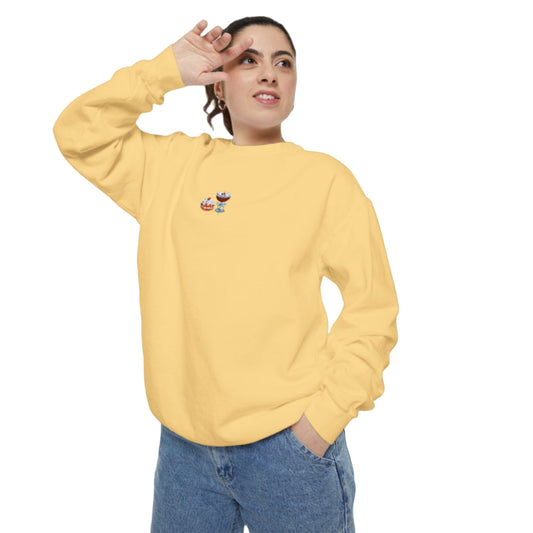 brunette woman celebrating hanukkah in style wearing a butter yellow crewneck featuring an embroidered design of sufganiyah and espresso martini